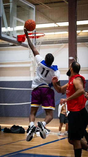 Player going for a layup at FitCourts drop-in basketball