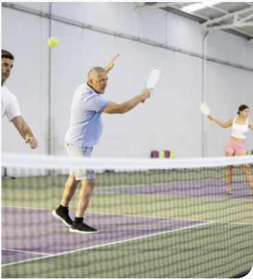 Pickleball action at the net during a FitCourts drop-in session